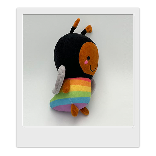 A side view image of Rainbee plushie